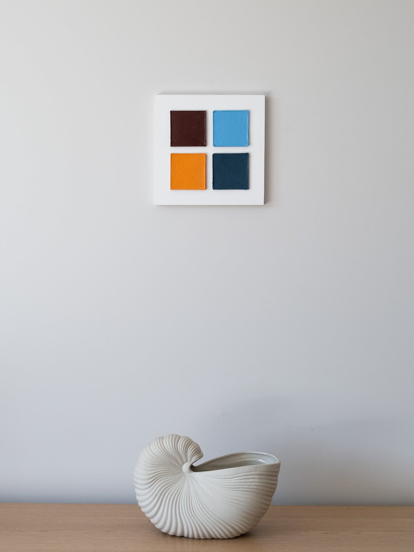 Bauhaus wall art Four Squares in Exile – Textured Cardboard on the wall 25 by 25 m