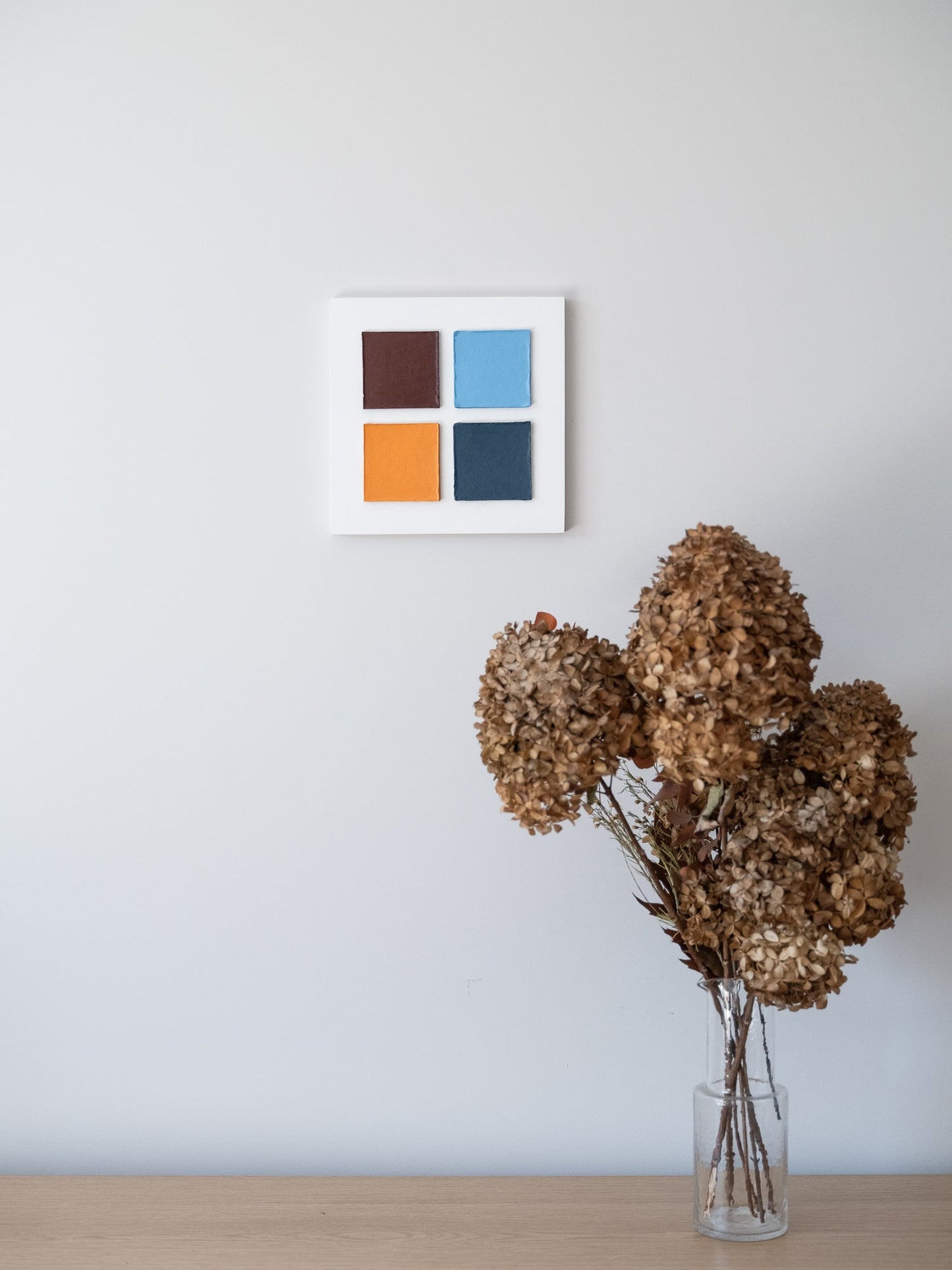 Geometry wall art Four Squares in Exile – Textured Cardboard on the wall